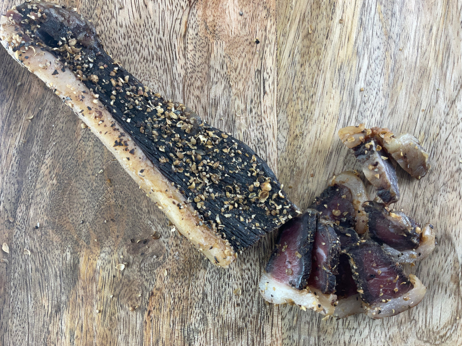 The image shows a steak of biltong, a popular South African dried meat snack.